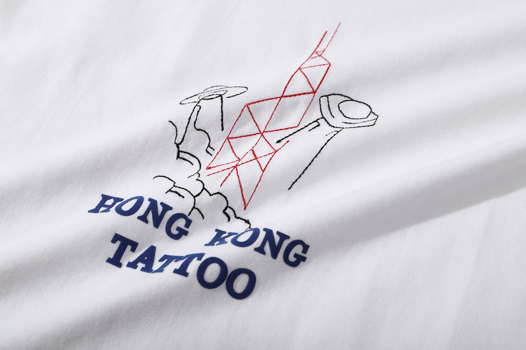 ih white cotton t shirt close up of the high quality tattoo inspired ufo embroidery and heat transferred wording