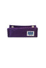 A folded purple fabric accessory, likely a belt or strap, featuring a small white rectangular patch with a blue graphic and two gold-tone snap buttons near the top edge, shown against a plain white background.
