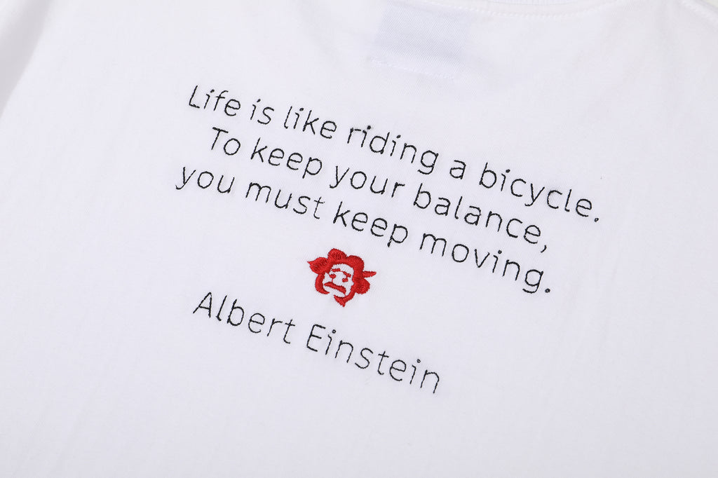 Einstein slogan embroidered cotton t-shirt “Life is like riding a bicycle. To keep your balance, you must keep moving.”