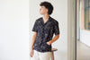 model mid-shot of a Hong Kong made GOC Studio black lucky bamboo Tencil linen shirt