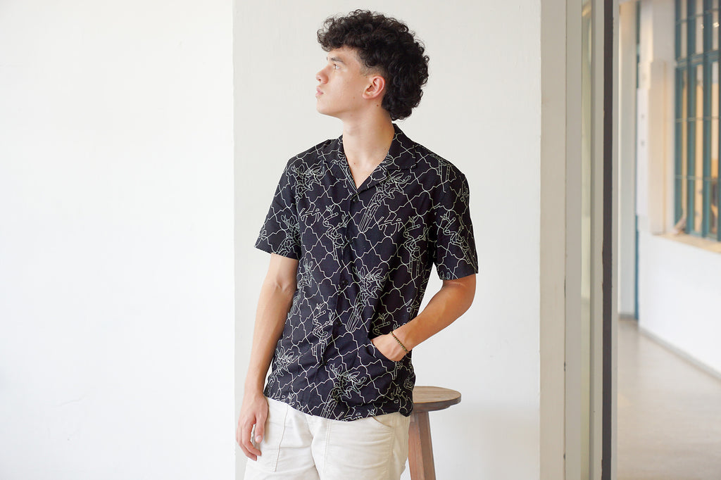 model mid-shot of a Hong Kong made GOC Studio black lucky bamboo Tencil linen shirt