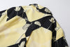 close up of centre back box pleat on a Hong Kong made GOC Studio black and yellow lotus Tencel linen shirt
