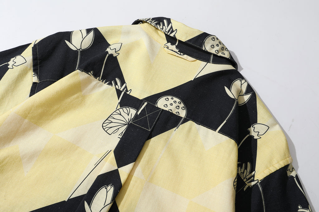 close up of centre back box pleat on a Hong Kong made GOC Studio black and yellow lotus Tencel linen shirt