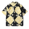back view of a Hong Kong made GOC Studio black and yellow lotus Tencel linen shirt