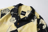 collar view of a Hong Kong made GOC Studio black and yellow lotus Tencel linen shirt