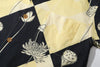 close up of matching pattered chest pocket on a Hong Kong made GOC Studio black and yellow lotus Tencel linen shirt