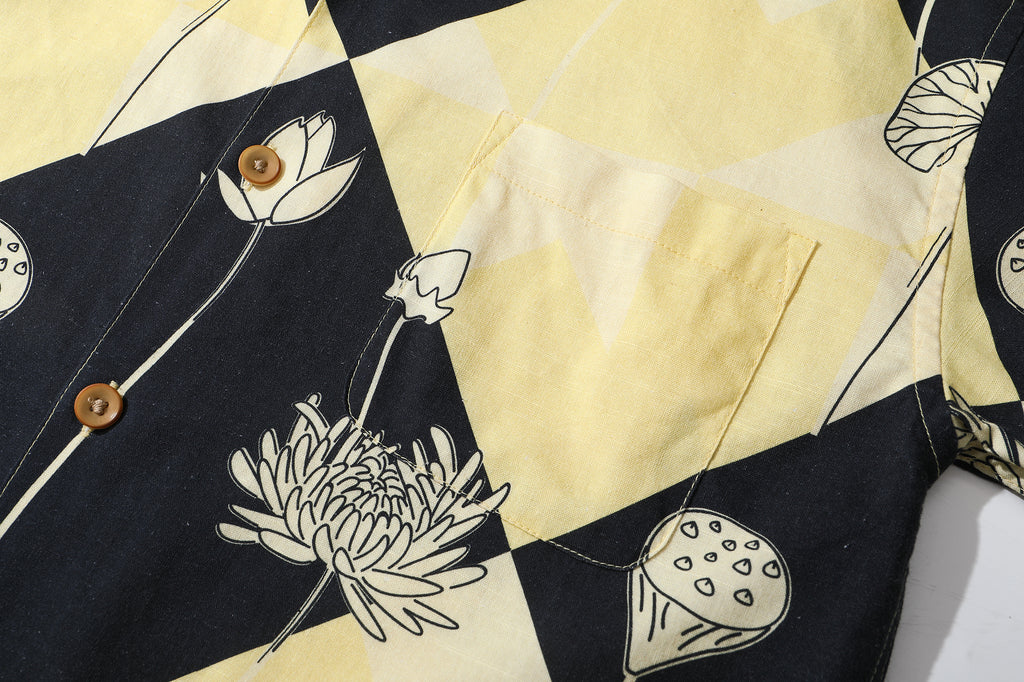 close up of matching pattered chest pocket on a Hong Kong made GOC Studio black and yellow lotus Tencel linen shirt