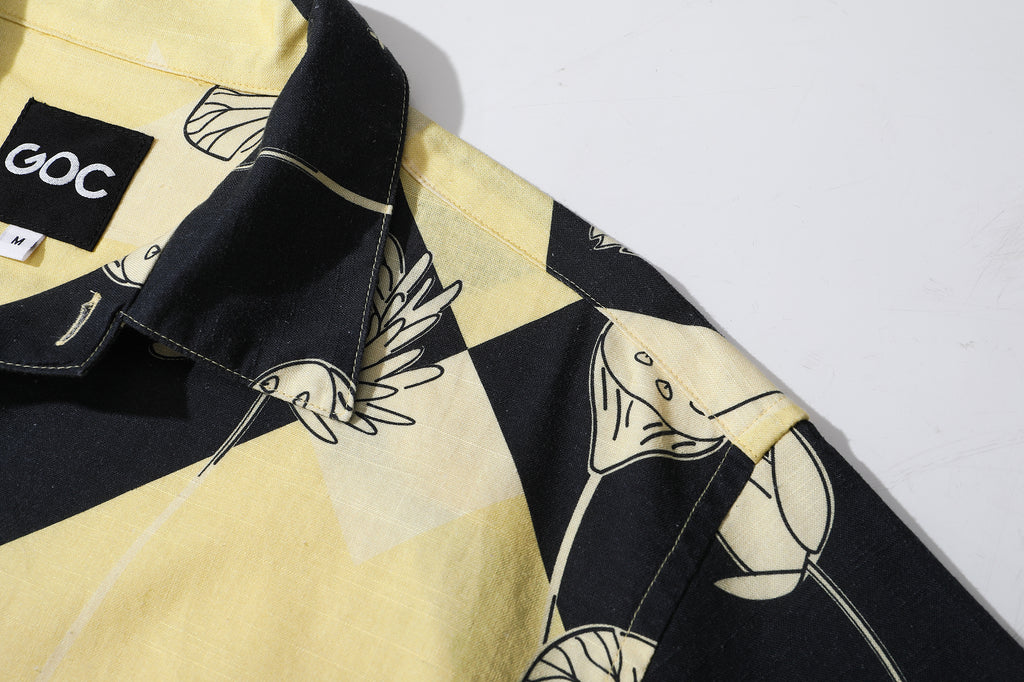 close up of shoulder on a Hong Kong made GOC Studio black and yellow lotus Tencel linen shirt