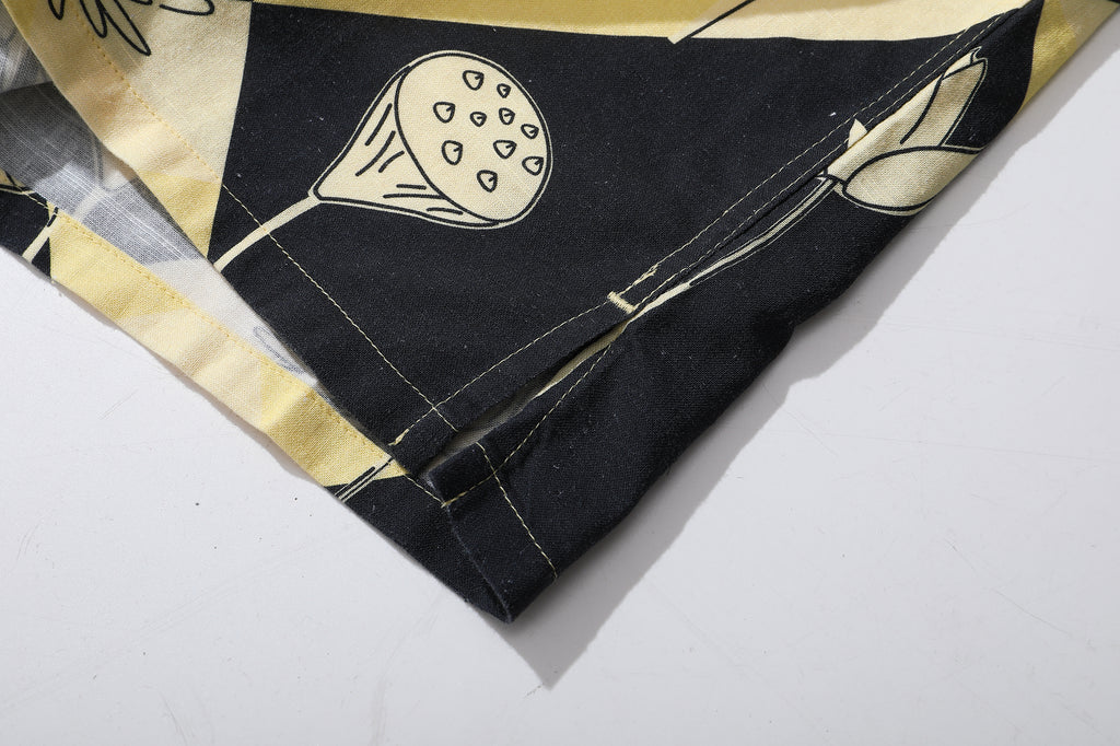 close up of side vent on a Hong Kong made GOC Studio black and yellow lotus Tencel linen shirt