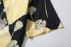 close up of sleeve hem and stitching detail  on a Hong Kong made GOC Studio black and yellow lotus Tencel linen shirt