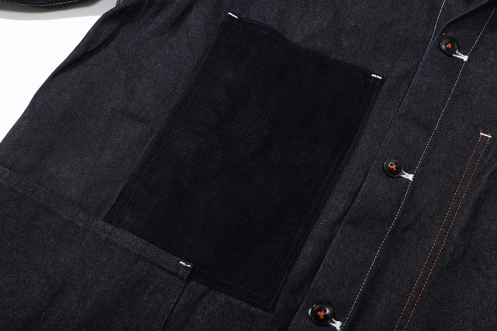 black corduroy chest pocket of a Hong Kong made GOC Studio Japanese cotton denim mix corduroy hip length jacket