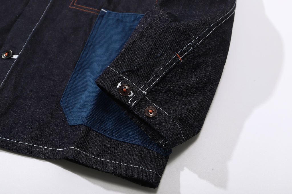 close up of sleeve hem and corozo button closure on a Hong Kong made GOC Studio Japanese cotton denim mix corduroy hip length jacket