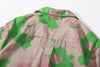 close up of centre back box pleat on a Hong Kong made GOC Studio green and pink daffodil Tencel linen shirt
