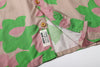close up of corozo button closure on a Hong Kong made GOC Studio green and pink daffodil Tencel linen shirt