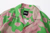 collar view of a Hong Kong made GOC Studio green and pink daffodil Tencel linen shirt