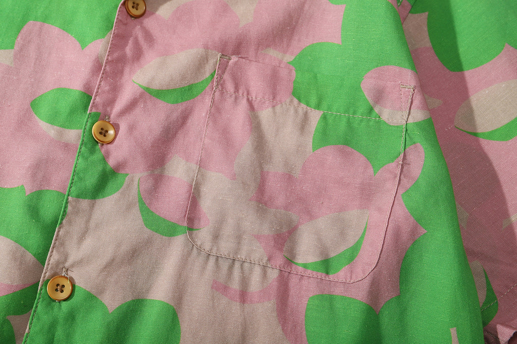 close up of matching pattered chest pocket on a Hong Kong made GOC Studio green and pink daffodil Tencel linen shirt