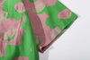 close up of sleeve hem and stitching detail  on a Hong Kong made GOC Studio green and pink daffodil Tencel linen shirt