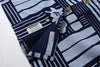 close up of corozo button closure on GOC Studio indigo dyed discharge city flower cotton shirt