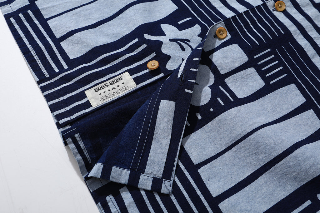 close up of corozo button closure on GOC Studio indigo dyed discharge city flower cotton shirt