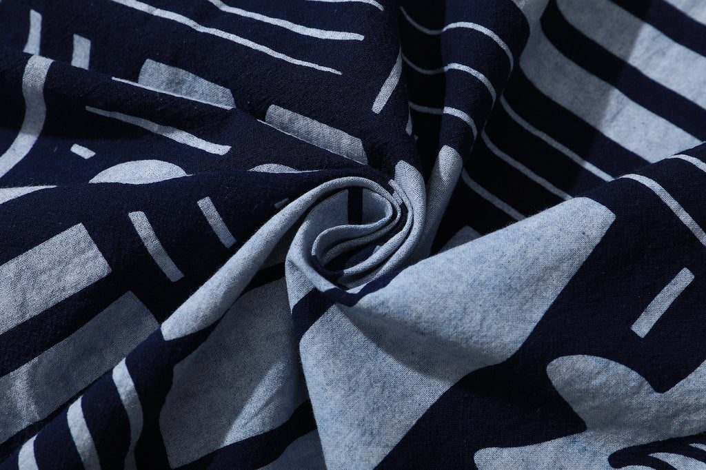 close up of hand indigo dyed discharge city flower cotton fabric texture
