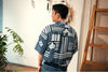 model back mid-shot of GOC Studio hand indigo dyed discharge city flower cotton shirt