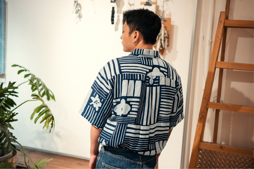 model back mid-shot of GOC Studio hand indigo dyed discharge city flower cotton shirt