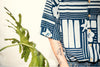 model close up shot of GOC Studio hand indigo dyed discharge city flower cotton shirt