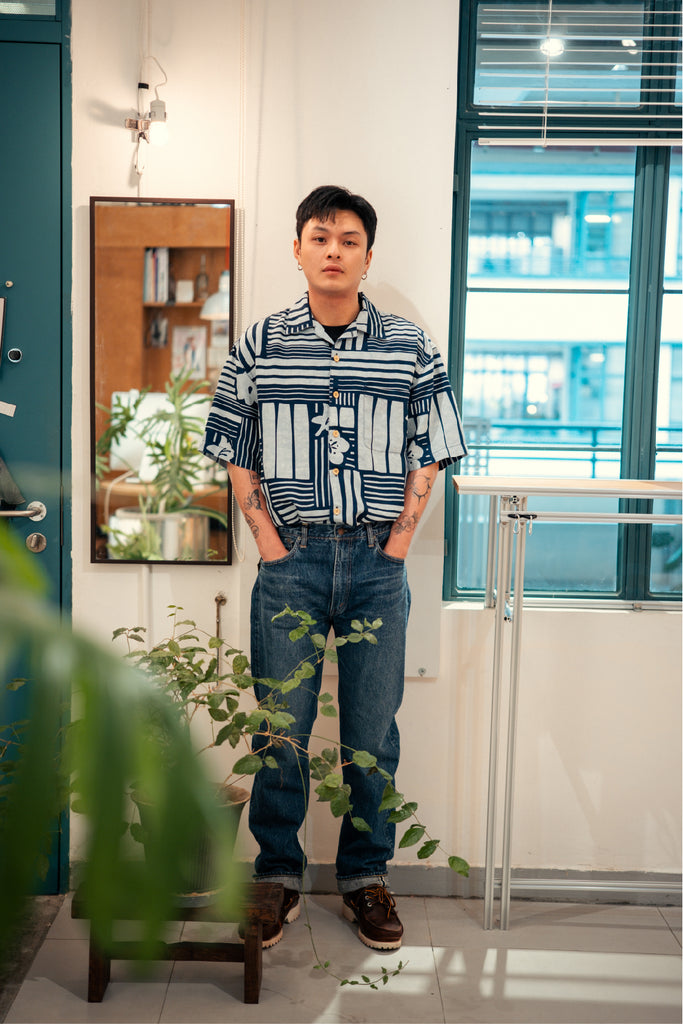 model full shot of GOC Studio hand indigo dyed discharge city flower cotton shirt
