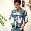 model front mid-shot of GOC Studio hand indigo dyed discharge city flower cotton shirt