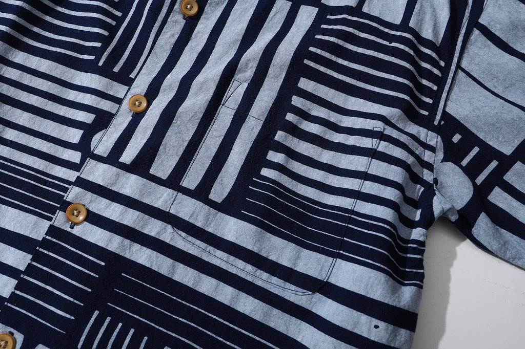 close up of matching patterned chest pocket on GOC Studio indigo dyed discharge city flower cotton shirt