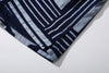 close up of side vent on GOC Studio indigo dyed discharge city flower cotton shirt