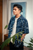 model mid-shot of GOC Studio hand indigo dyed discharge field flower cotton shirt
