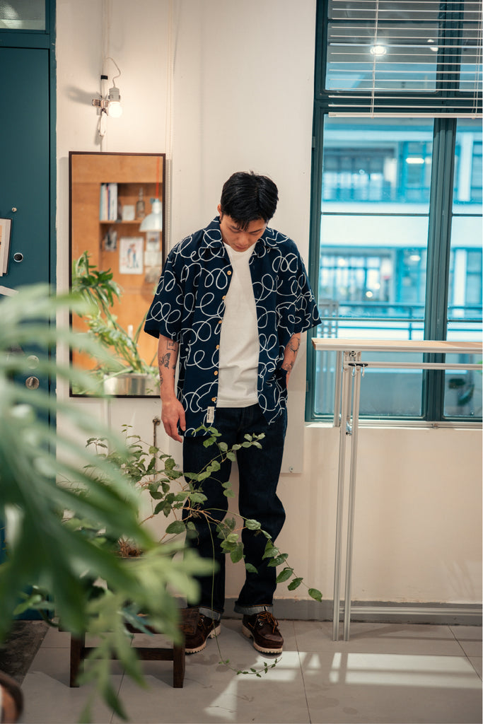 model full shot of GOC Studio hand indigo dyed discharge field flower cotton shirt