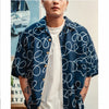 model front close up shot of GOC Studio hand indigo dyed discharge field flower cotton shirt