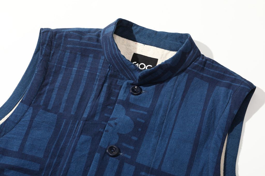close up of stand collar with corduroy accents on goc studio indigo dyed discharge floral print cotton vest 