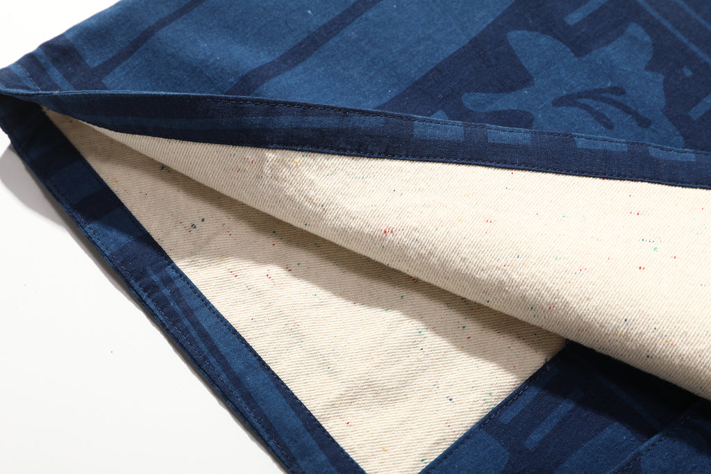 close up of multi coloured nepped contrast lining on goc studio indigo dyed discharge floral print cotton vest 