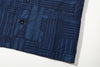 close up of front patch pocket on goc studio indigo dyed discharge floral print cotton vest 