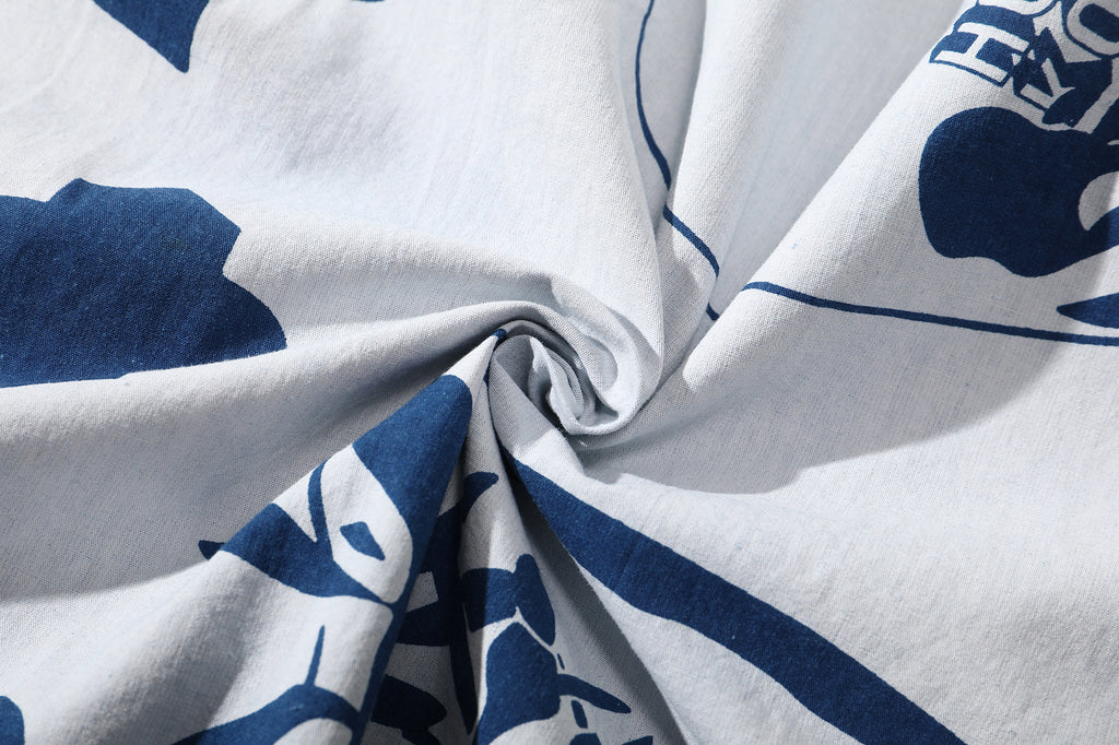 close up of hand indigo dyed discharge teapot floral print cotton fabric texture