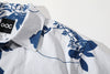 close up of shoulder on goc studio indigo dyed discharge teapot floral print cotton shirt