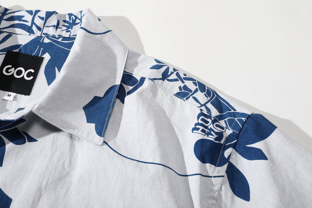 close up of shoulder on goc studio indigo dyed discharge teapot floral print cotton shirt