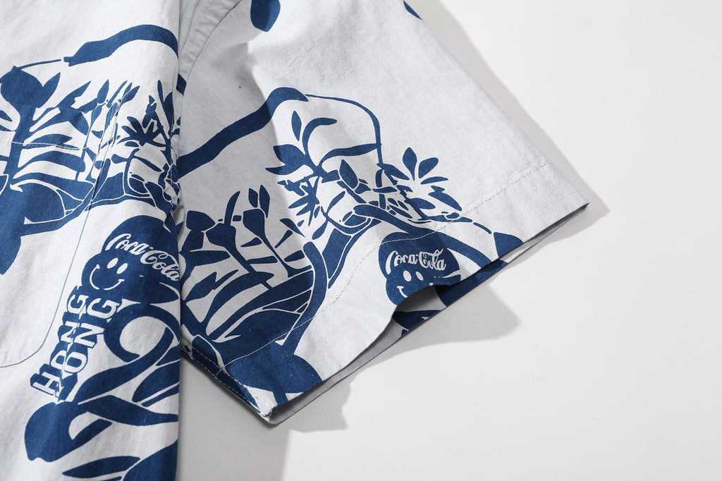 close up of sleeve hem and stitching detail on goc studio indigo dyed discharge teapot floral print cotton shirt