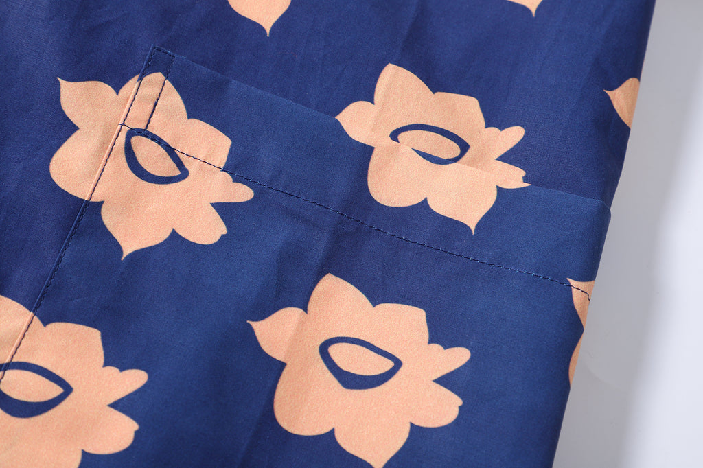 close up of matching patterned patch pocket on a Hong Kong made GOC Studio navy and orange daffodil cotton poplin shirt