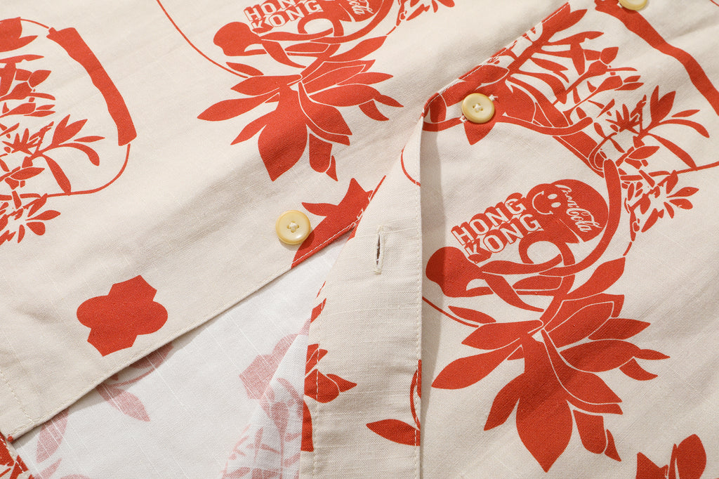close up of corozo button closure on a Hong Kong made GOC Studio orange teapot Tencel linen shirt