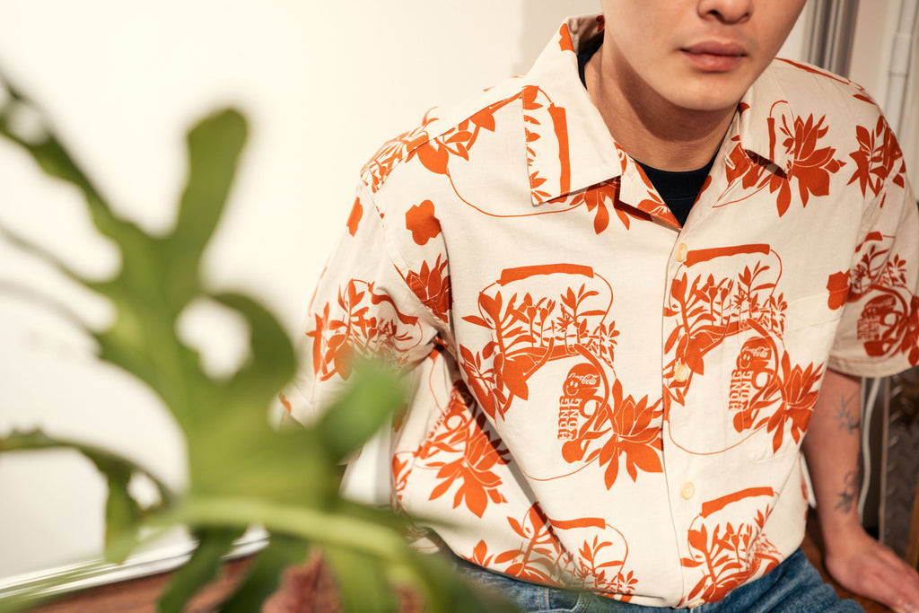 model close up shot of a Hong Kong made GOC Studio orange teapot Tencel linen shirt