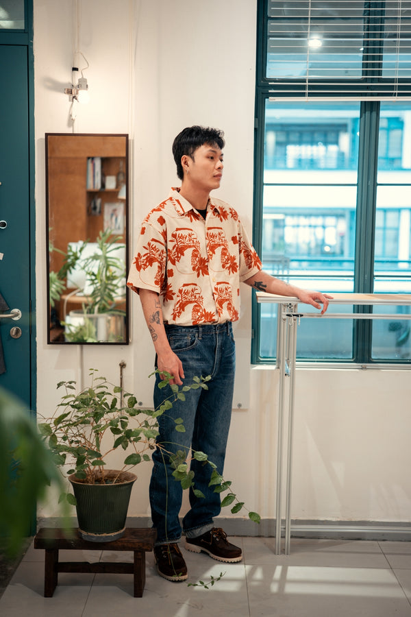 model full shot of a Hong Kong made GOC Studio orange teapot Tencel linen shirt