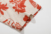 close up of sleeve hem and stitching detail  on a Hong Kong made GOC Studio orange teapot Tencel linen shirt