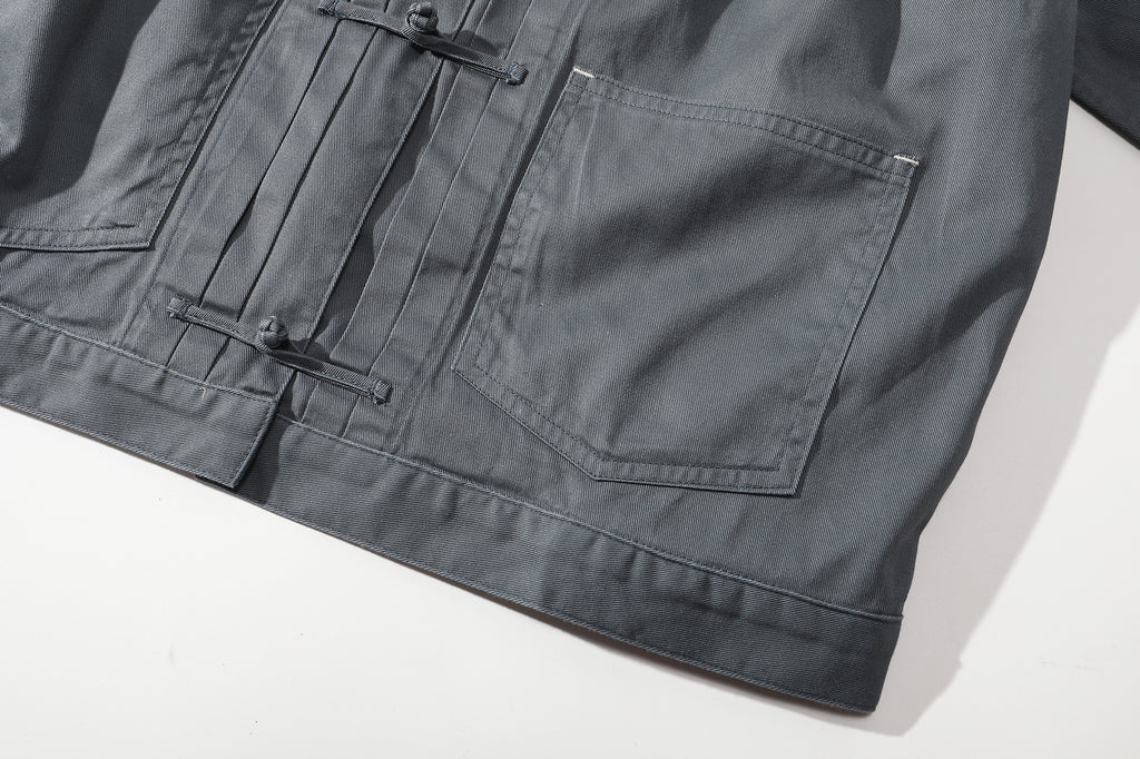 close up of front patch pocket on a Hong Kong made GOC Studio steel blue Japanese cotton twill oriental jacket