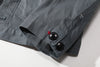 close up of sleeve hem and corozo button closure on a Hong Kong made GOC Studio steel blue Japanese cotton twill oriental jacket