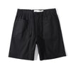 Front view of a Hong Kong made ih cotton herringbone buckle shorts in black