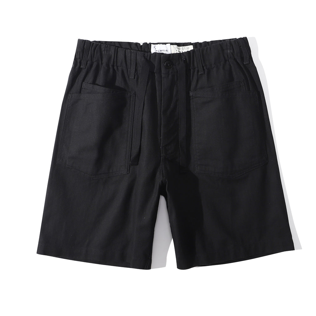 Front view of a Hong Kong made ih cotton herringbone buckle shorts in black